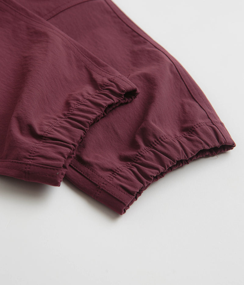 Nike ACG Trail Pants in Night Maroon and Deep Jungle / Summit White
