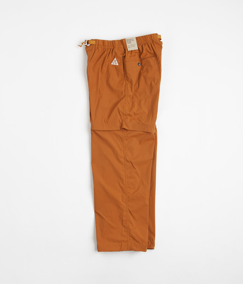 Nike ACG Trail Zip-Off Pants in Dark Russet and Monarch / Summit White