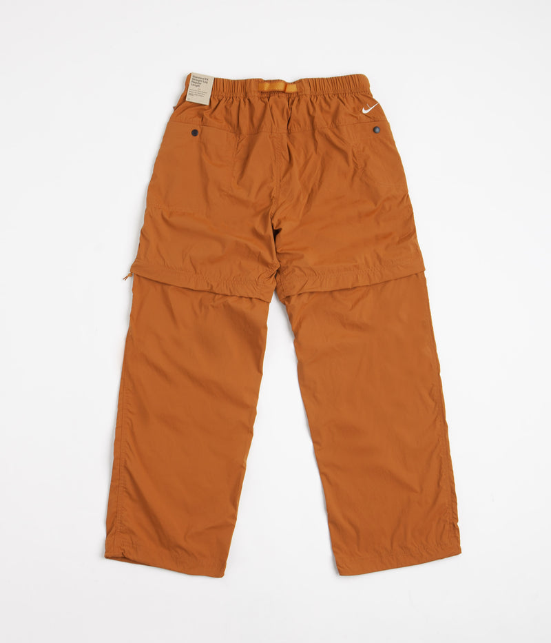 Nike ACG Trail Zip-Off Pants in Dark Russet and Monarch / Summit White