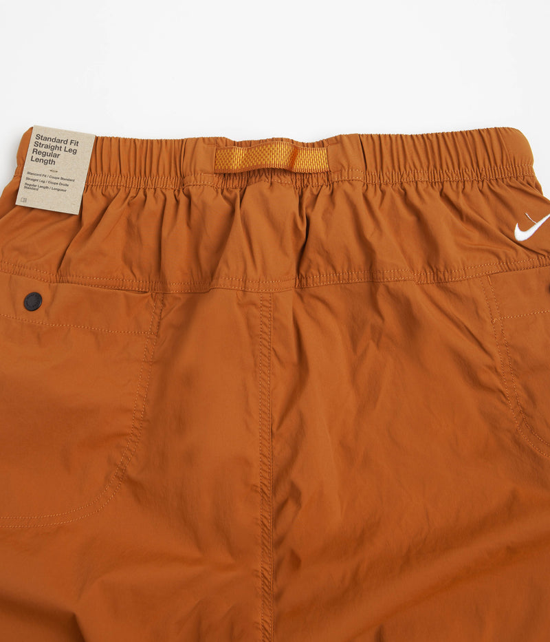 Nike ACG Trail Zip-Off Pants in Dark Russet and Monarch / Summit White