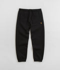 Carhartt Chase Sweatpants in Black and Gold / Black