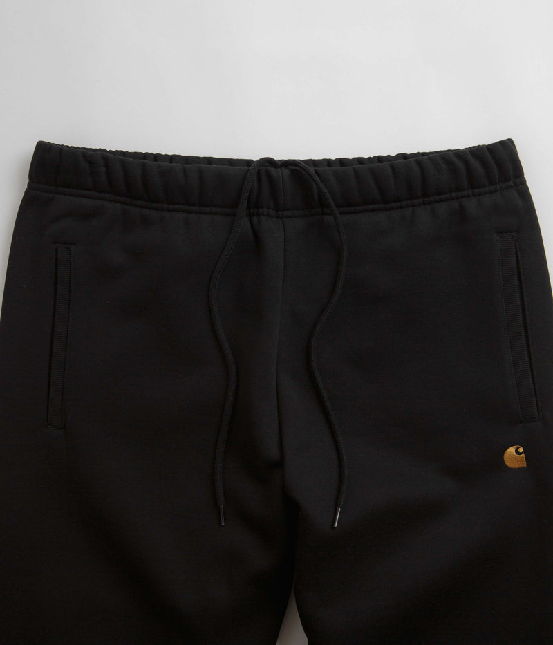 Carhartt Chase Sweatpants in Black and Gold / Black