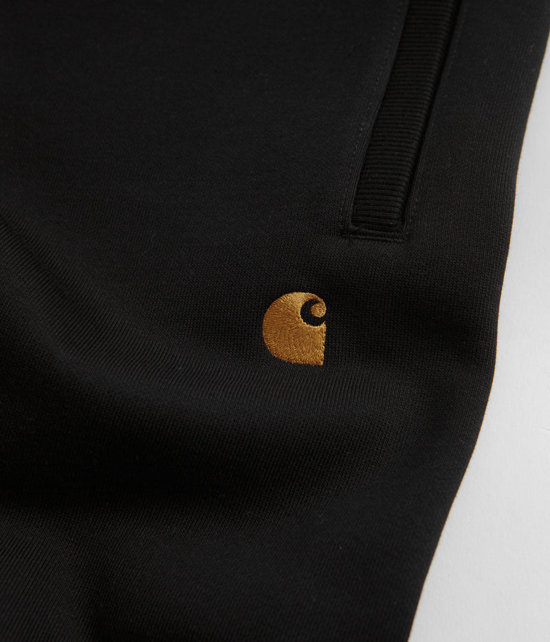 Carhartt Chase Sweatpants in Black and Gold / Black