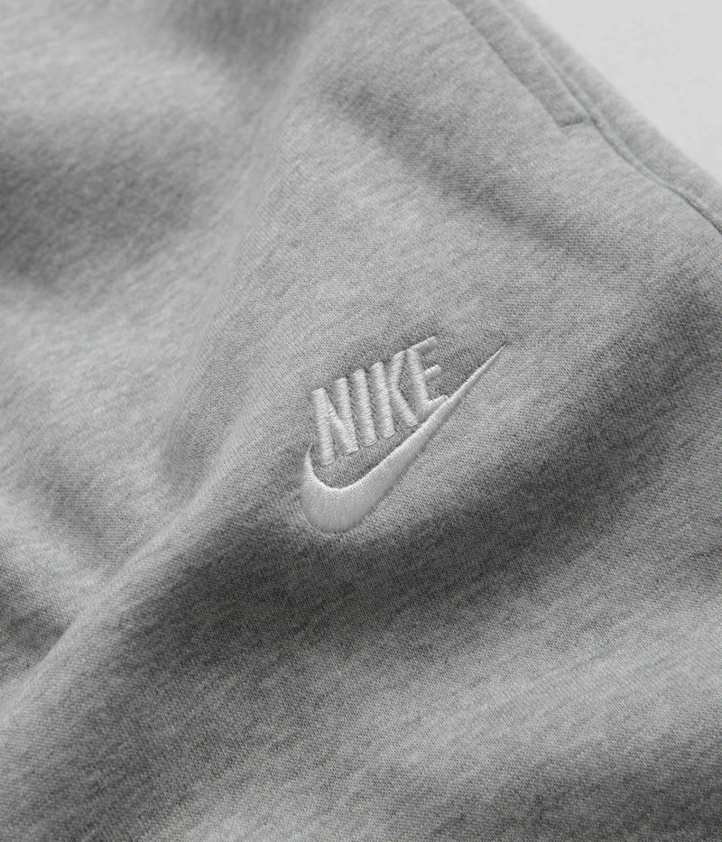 Nike Club Fleece Joggers in Dark Grey Heather and Matte Silver / White