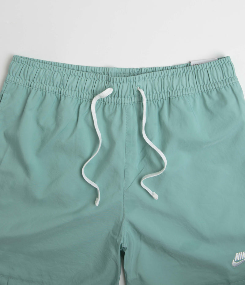 Nike Flow Shorts in Mineral and White