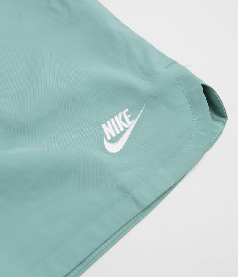 Nike Flow Shorts in Mineral and White