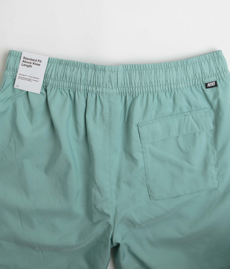 Nike Flow Shorts in Mineral and White