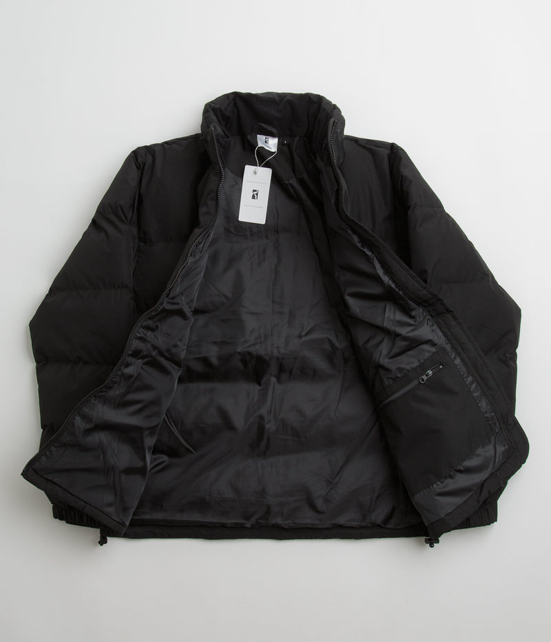 Poetic Collective Puffer Jacket in Black and White
