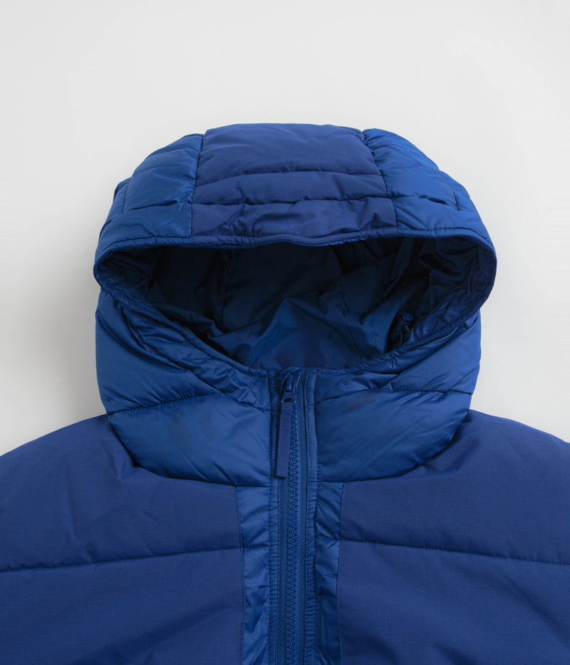 Pop Trading Company Puffer Jacket in Sodalite Blue