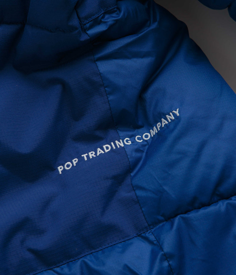 Pop Trading Company Puffer Jacket in Sodalite Blue