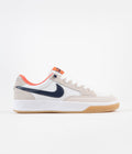 Nike SB Adversary Premium Shoes in White and Midnight Navy and Turf Orange