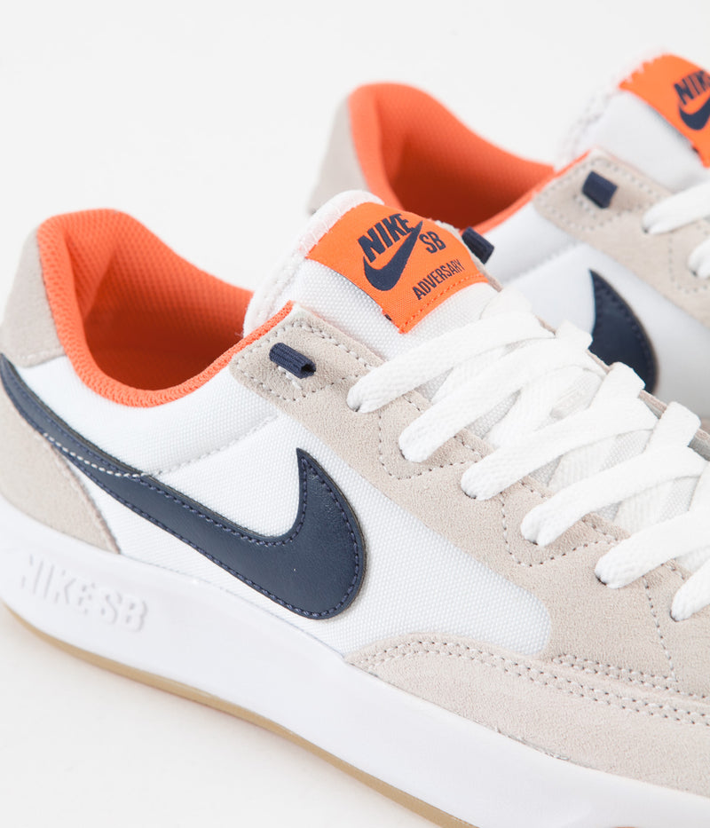 Nike SB Adversary Premium Shoes in White and Midnight Navy and Turf Orange