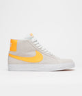 Nike SB Blazer Mid Shoes in Summit White and Laser Orange and Summit White