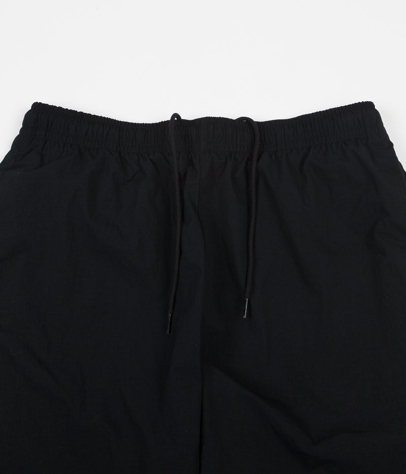 Nike SB Swoosh Track Pants in Black and White / White