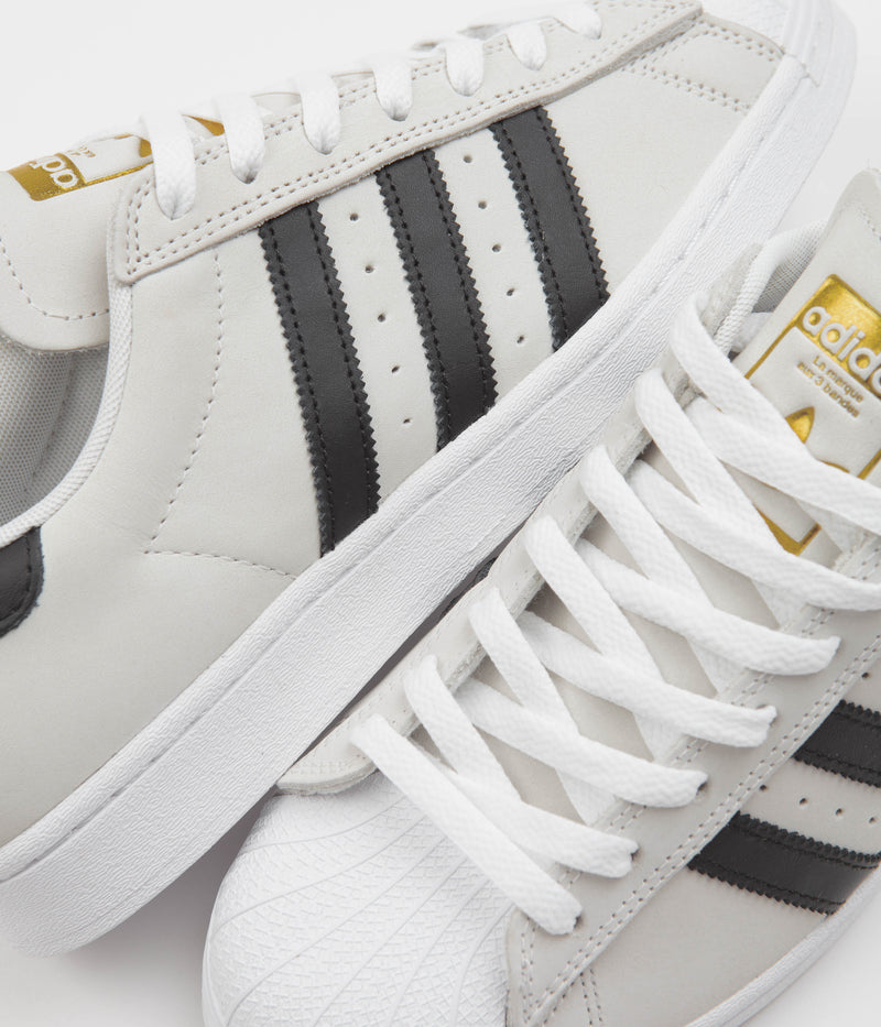 Adidas Superstar Shoes in White and Core Black / Gold Metallic