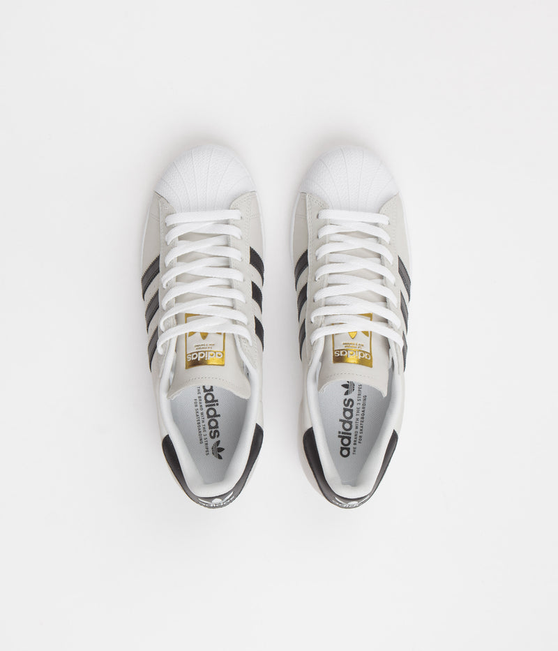 Adidas Superstar Shoes in White and Core Black / Gold Metallic