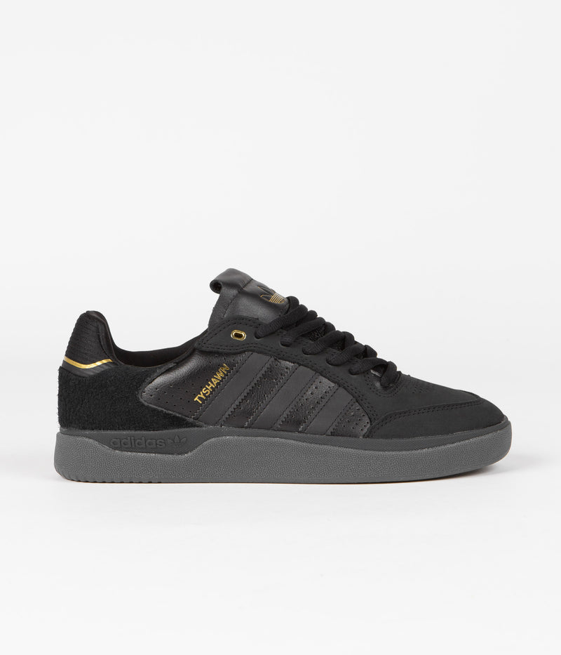 Adidas Tyshawn Low Shoes in Core Black and Core Black / Gold Metallic / Core Black