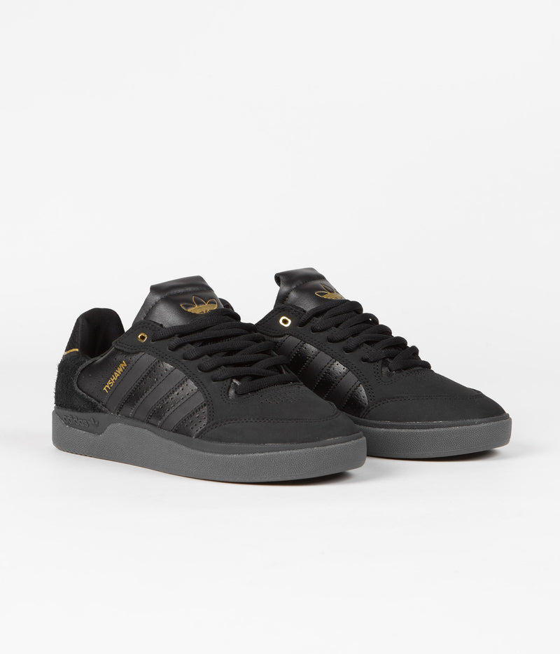 Adidas Tyshawn Low Shoes in Core Black and Core Black / Gold Metallic / Core Black