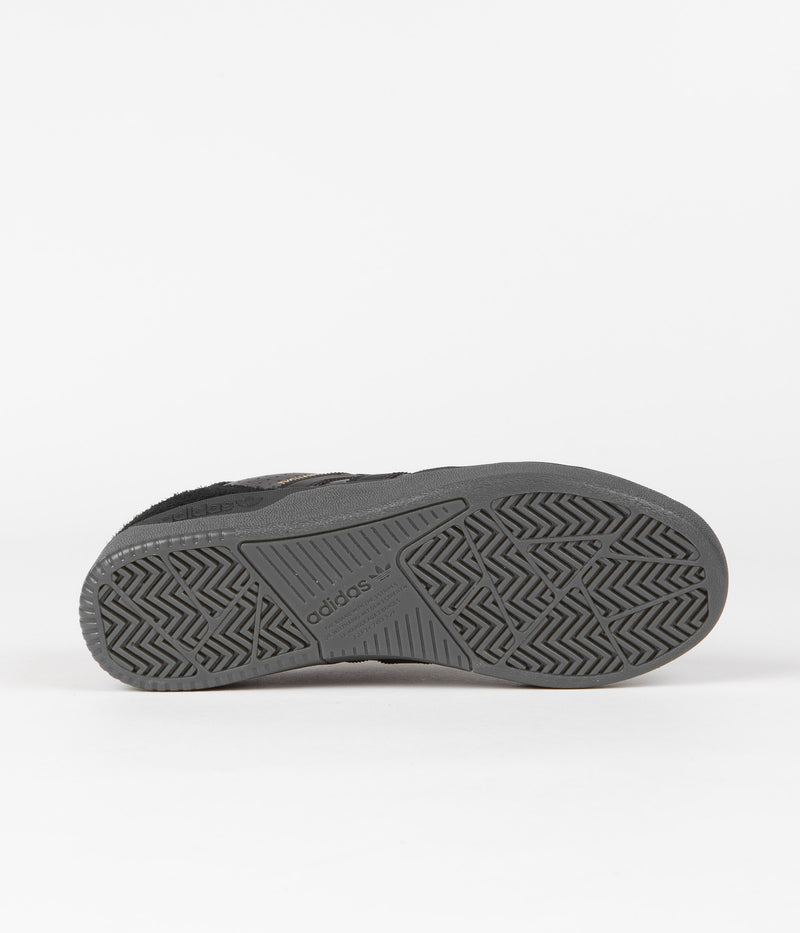 Adidas Tyshawn Low Shoes in Core Black and Core Black / Gold Metallic / Core Black